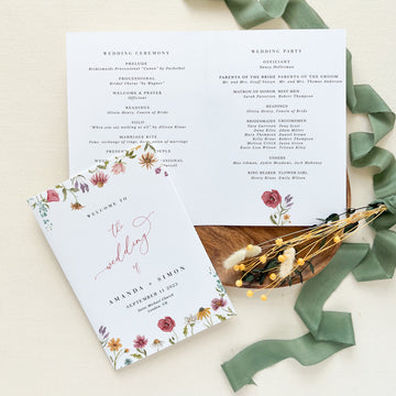a close up of a wedding program on a table