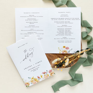 a close up of a wedding program on a table