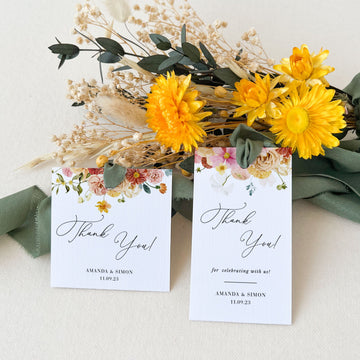 a bouquet of sunflowers and a thank you card