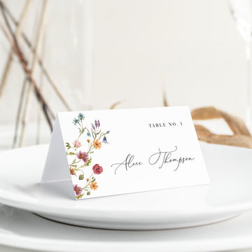 a place card sitting on top of a white plate